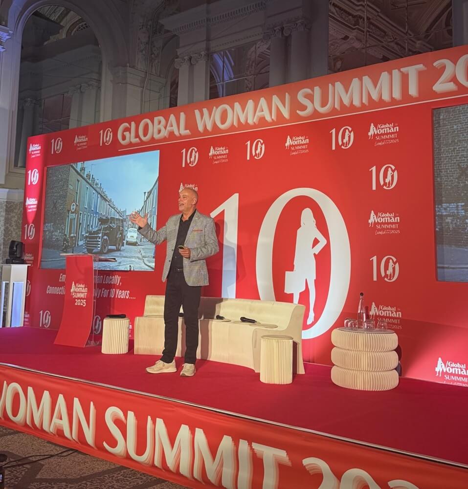 Andrew Scott speaking at Global Woman Summit London 2025 on stage at Grand Connaught Rooms