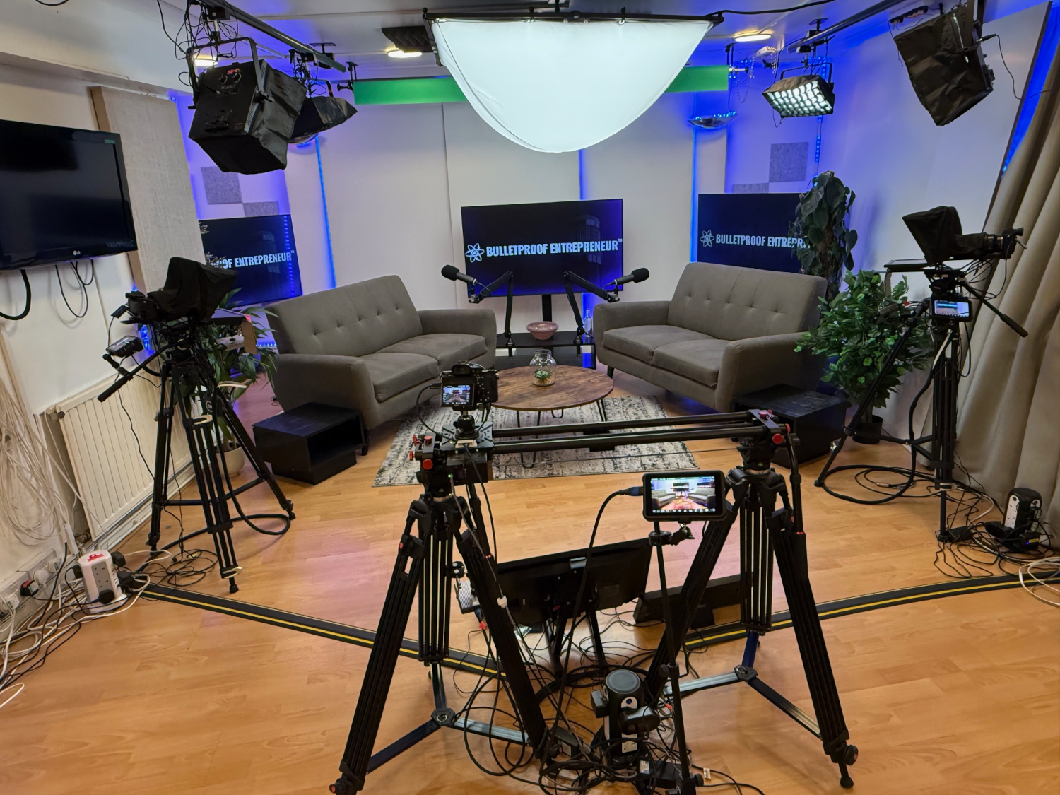 Andrew Scott Bulletproof Entrepreneur Podcast studio setup with cameras, lighting and interview seating